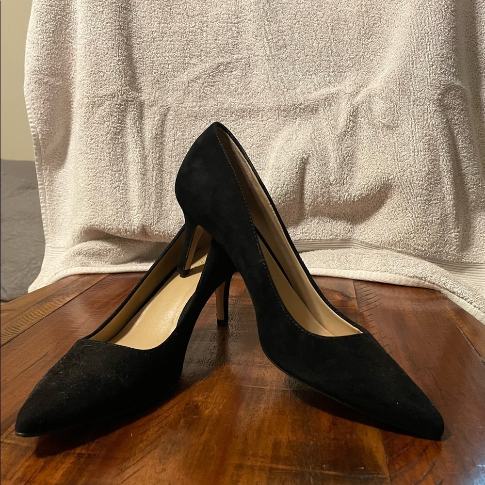 Brand new black pumps size 7.